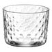 A clear Acopa hobnail style rocks glass with a textured surface.