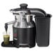 A Hamilton Beach Otto Auto Feed Juice Extractor with a green drink in a plastic cup.