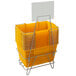 A stack of yellow Regency market shopping baskets with a white sign.