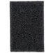 A close up of a black Scrubble grill polish pad.