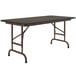 A walnut Correll rectangular folding table with a metal frame.