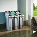 A group of Rubbermaid Slim Jim recycling lids on white rectangular trash cans.