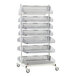 A Metro qwikSIGHT double sided metal shelf with seven baskets on it.