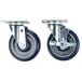 A pair of Alto-Shaam casters with black rubber wheels.