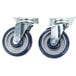 A pair of blue and grey Alto-Shaam casters with rubber wheels.