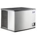 A silver and black Manitowoc Indigo NXT water cooled ice machine with a vent.