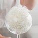 A close up of a Franmara glassware washing brush with a white foam head.