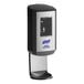 A black and silver Purell hand sanitizer dispenser with a clear plastic door.