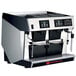 A silver and black Grindmaster espresso machine with two coffee machines on top.