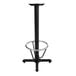 A Lancaster Table & Seating black cast iron bar height table base with a round metal foot ring.