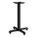 A black Lancaster Table & Seating cast iron pedestal table base.