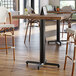 A Lancaster Table & Seating black bar height column table base with a black pole.