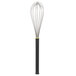 A Matfer Bourgeat stainless steel wire whisk with a black Exoglass handle.