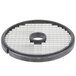 A circular metal dicing grid with holes.