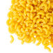 A pile of Costa Pasta elbow macaroni on a white background.