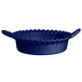 A blue bowl with handles and a textured wavy edge.