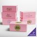 A group of 8" x 5" x 3 1/2" pink customizable bakery boxes.