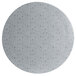A white round metal disc with black specks.