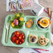 A Carlisle green 6 compartment tray with left handed food on it.