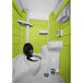 A lime green portable restroom with a black toilet seat and white pipe.