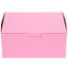 A pink bakery box with a lid.