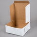 A white bakery box with a lid.