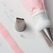 A close-up of a pink plastic pastry nozzle.