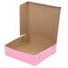 A pink bakery box with the lid open.