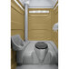 A PolyJohn tan portable restroom with a translucent top.