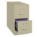 A Hirsh Industries putty vertical file cabinet with two drawers, one open.