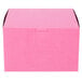 A pink bakery box with a lid.