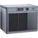 A grey rectangular Follett water cooled ice machine with a vent.