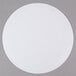 A 16" white corrugated cake circle on a gray surface.