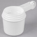 A white Rubbermaid plastic measuring cup with a handle.