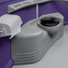 A purple PolyJohn wheelchair accessible portable toilet with a seat and a lid.