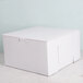 A white bakery box with a lid.