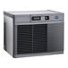 A large, rectangular, water-cooled commercial ice machine with a vented front panel and control display.