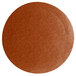 A brown round disc with specks on a white background.