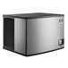A silver and black Manitowoc Indigo NXT air cooled ice machine on a white background.