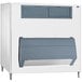 A white and grey Follett ice storage bin with a grey door.