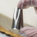 a close-up of a hand holding a metal object