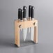 A Mercer Culinary Genesis 6-piece knife block set in a wooden block.