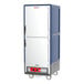 A blue Metro C5 heated holding cabinet with white doors on wheels.