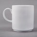 A close-up of the white handle on a Libbey Rigel Constellation mug.