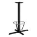 A Lancaster Table & Seating black cast iron bar height table base with a foot ring.