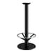 A Lancaster Table & Seating black cast iron bar height table base with a round foot ring.