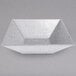 a white container with a triangular shape