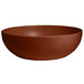 A brown G.E.T. Enterprises Bugambilia resin-coated aluminum bowl.