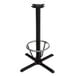 A Lancaster Table & Seating black cast iron bar height table base with a foot ring.