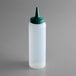 A white plastic squeeze bottle with a green cap.